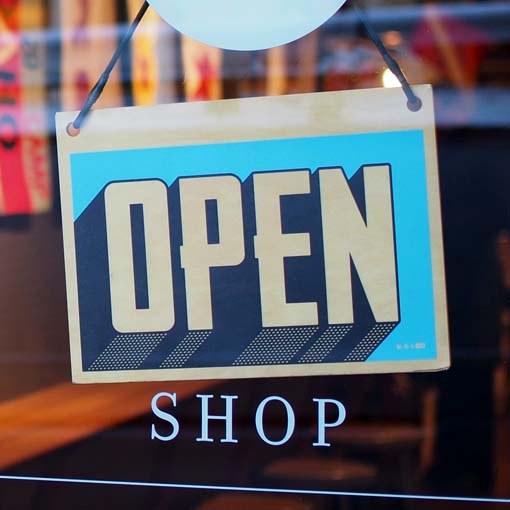 'Open' sign on shop door.